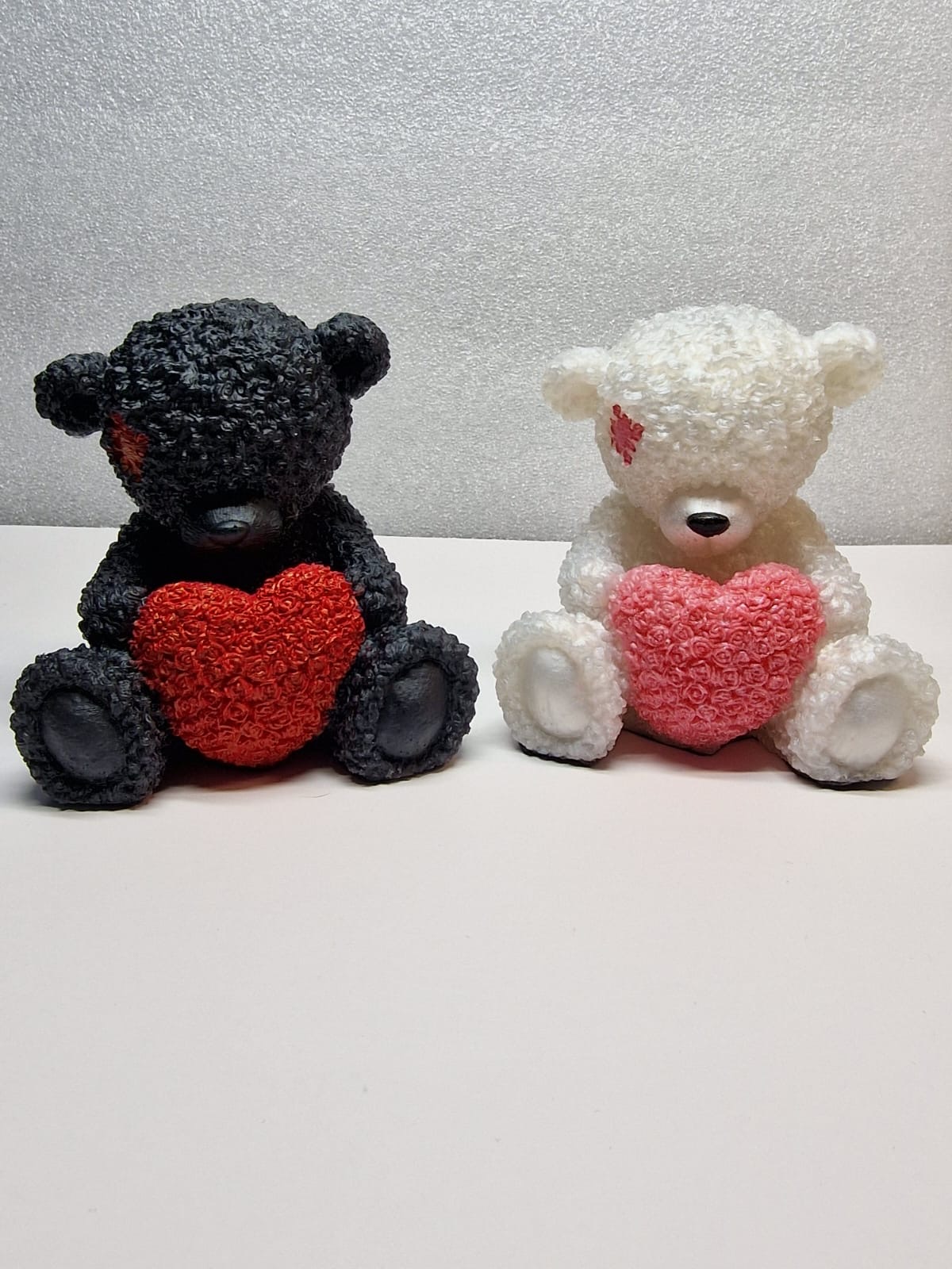 Black and white teddy bears together