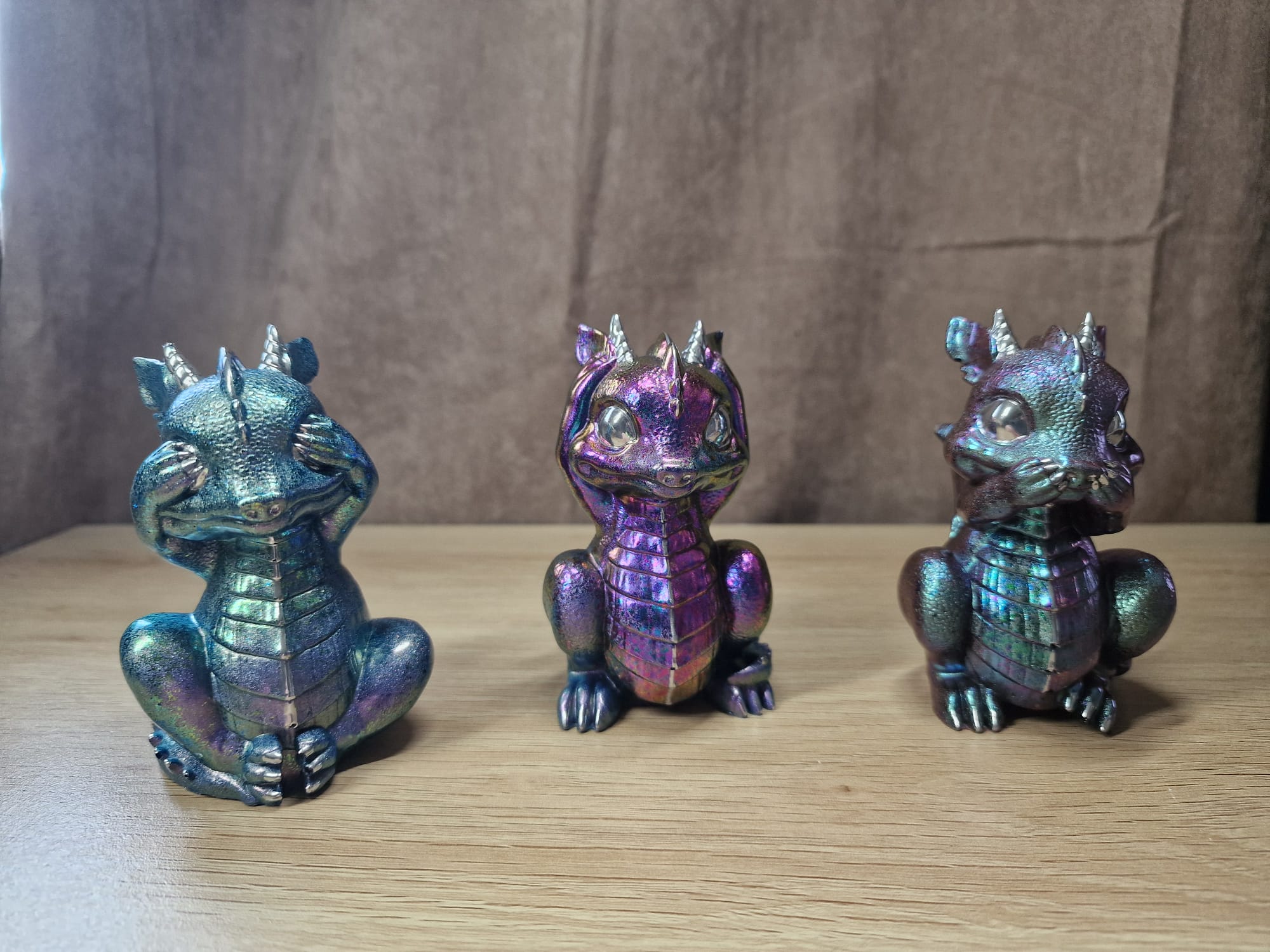 Iridescent dragon figurines