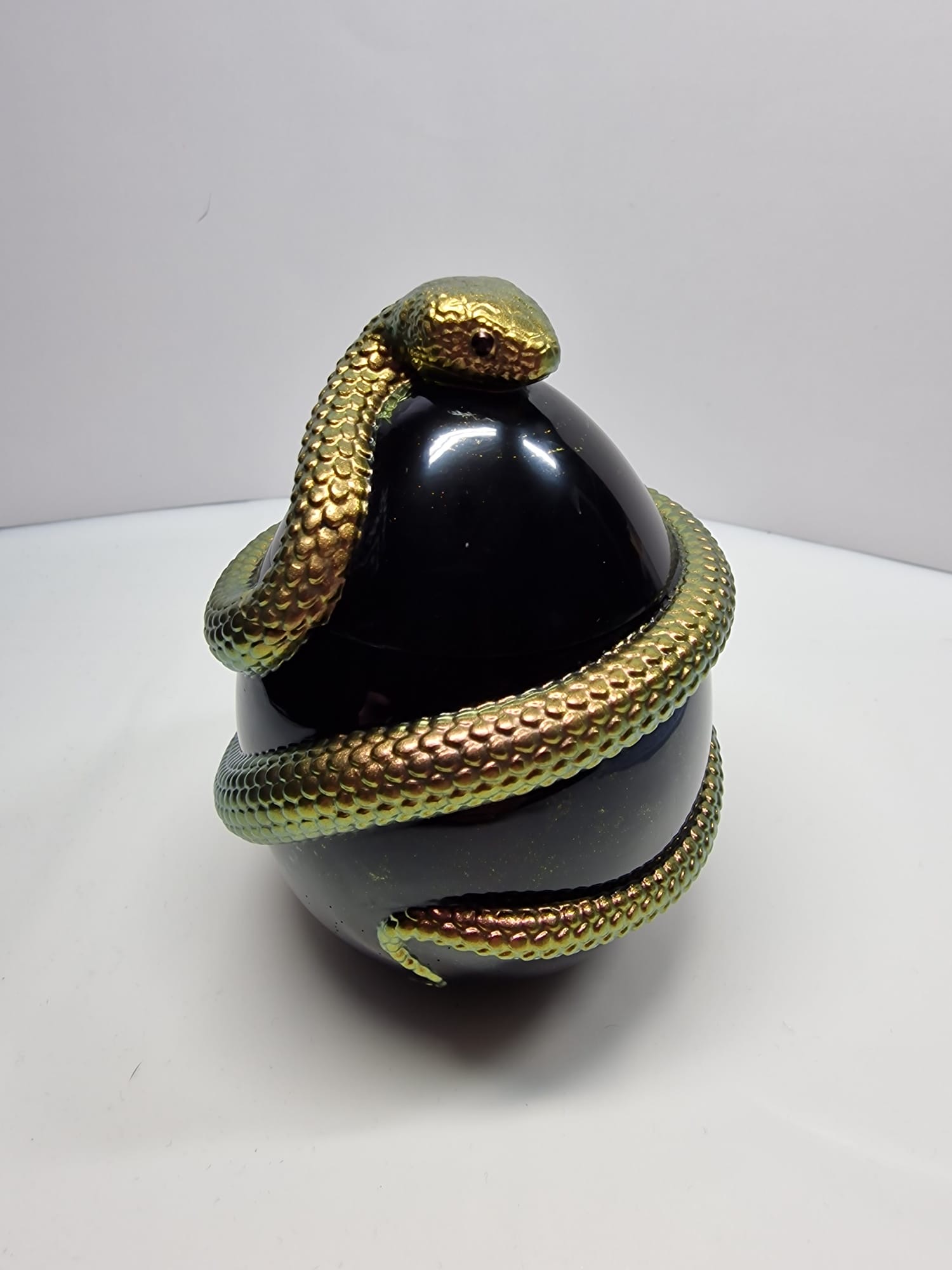 Golden metallic snake sculpture