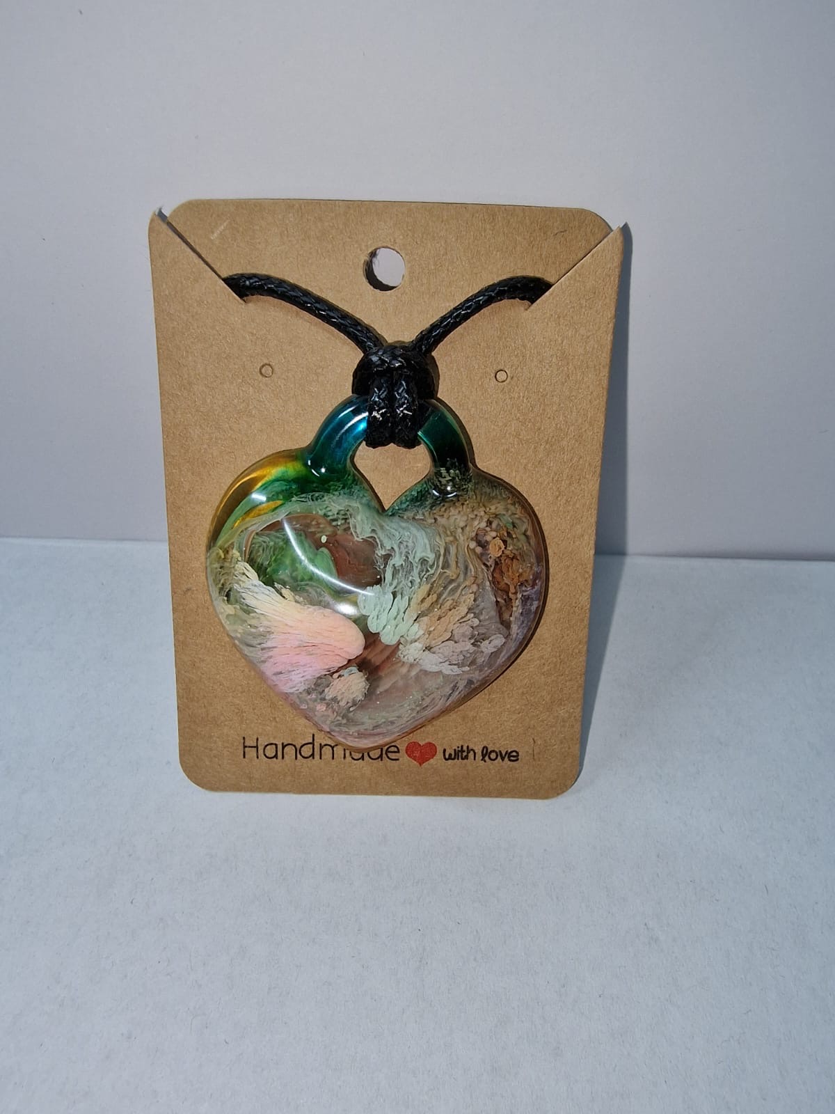 Resin heart pendant with swirled colors